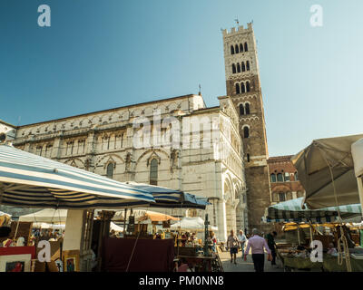Cathedral of St Martin (San Martino), Piazza Antelminelli, on a market day in the walled city of Lucca, Tuscany, Italy Stock Photo
