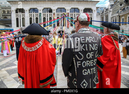 London UK  16 September 2018 Pearly Kings and Queens Harvest Festival at Guildhall Yard,Dressed in their best dark suits covered in hundreds of bright pearl buttons, the Pearly Kings and Queens of London got  together for the biggest event in the Pearly calendar, they celebrate the bounty of the autumn harvest with traditional entertainment in front of Guildhall, before parading through the streets to St Mary Le Bow Church for a service of thanksgiving.With  Morris dancing, maypole dancing, marching bands and lots of colorful characters at this traditional event.@Paul Quezada-Neiman/Alamy Live Stock Photo
