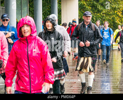 Leith, Edinburgh, Scotland, UK, 16th September 2018. Edinburgh Kilt Walk takes place today. Walkers raise funds for a charity of their choice. The kilt walkers reach The Shore at about Mile 14 in the rain. A man wearing a kilt with a large sporran Stock Photo