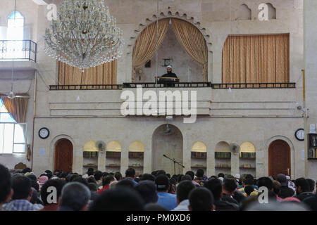 September 14, 2018 - Friday prayers takes place in the Saad mosque in the city of Idlib. During the sermon the preacher delivered a speech about the history of the Al-Assad family and how they played an important role in the decline of Syria and of the Islamic faith in the country. Idlib, which is believed to host three million Syrians, many of whom were evacuated from Eastern Ghouta, Aleppo, Deera and other former rebel-held areas, is under the control of opposition rebel groups. As it remains the latest major opposition stronghold in Syria a seemingly imminent full-scale offensive on Syria's Stock Photo