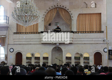 September 14, 2018 - Friday prayers takes place in the Saad mosque in the city of Idlib. During the sermon the preacher delivered a speech about the history of the Al-Assad family and how they played an important role in the decline of Syria and of the Islamic faith in the country. Idlib, which is believed to host three million Syrians, many of whom were evacuated from Eastern Ghouta, Aleppo, Deera and other former rebel-held areas, is under the control of opposition rebel groups. As it remains the latest major opposition stronghold in Syria a seemingly imminent full-scale offensive on Syria's Stock Photo