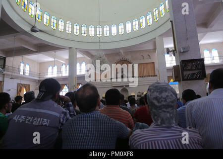 September 14, 2018 - Friday prayers takes place in the Saad mosque in the city of Idlib. During the sermon the preacher delivered a speech about the history of the Al-Assad family and how they played an important role in the decline of Syria and of the Islamic faith in the country. Idlib, which is believed to host three million Syrians, many of whom were evacuated from Eastern Ghouta, Aleppo, Deera and other former rebel-held areas, is under the control of opposition rebel groups. As it remains the latest major opposition stronghold in Syria a seemingly imminent full-scale offensive on Syria's Stock Photo