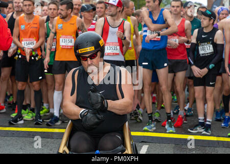 Warrington, UK. 16 September 2018.  The English Half Marathon, EHM, is celebrating it's 10th year in 2018. Rain had been forecast for the event but after an initial wet gathering the wet weather held off until the end of the run. Starting from a massed grid line-up in Winmarleigh Street, Warrington, Cheshire, England, the course follows the streets of the Town and concludes by crossing the red carpet finish through the iconic Golden Gates of Warrington Town Hall. It also hosts a 10k race at the same time Credit: John Hopkins/Alamy Live News Stock Photo