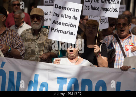 Madrid, Spain. 16th Sep, 2018. Protesters seen holding a banner that say, No to delays in primary care appointments, and posters during the demonstration.People protest on the streets of Madrid in defense of Public Health and against cuts in the primary care of Public Health. Credit: Lito Lizana/SOPA Images/ZUMA Wire/Alamy Live News Stock Photo
