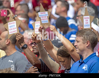 Landover, Maryland, USA. 16th Sep, 2018. Fans hold up signs as the National Anthem is played prior to the game pitting Indianapolis Colts against the Washington Redskins at FedEx Field in Landover, Maryland on Sunday, September 16, 2018 Credit: Ron Sachs/CNP/ZUMA Wire/Alamy Live News Stock Photo