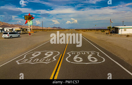 World famous and historic Route 66 signs on road at iconic Roy's Motel and Cafe in Amboy, California Stock Photo