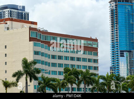 MIAMI, USA - AUGUST 22, 2018: Holiday Inn hotel sign. Holiday Inn is an American brand of hotels, and a subsidiary of InterContinental Hotels Group. Stock Photo