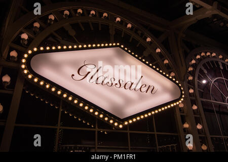 COPENHAGEN, DENMARK, MARCH 31, 2018: The sign for the world Famous Glass house Theatre in Tivoli, Copenhagen, is illuminated at night Stock Photo