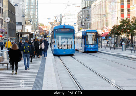 Stockholm, Sweden - September 13, 2018: Two blue modern trams in service for SL on line 7 has stoped at the tram stop T-Centralen located in the Klara Stock Photo