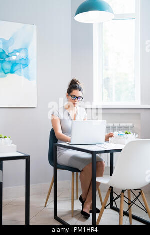 Beautiful Businesswoman Working in Cafe Stock Photo