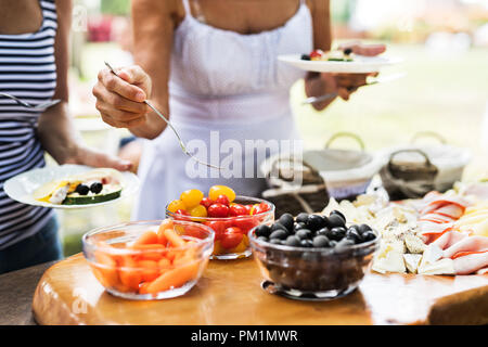 Family celebration or a garden party outside in the backyard. Close up. Stock Photo