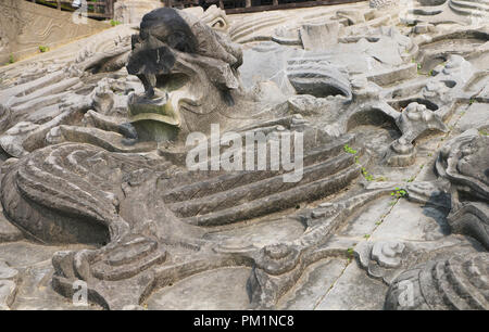 A relief dragon carved in stone Stock Photo