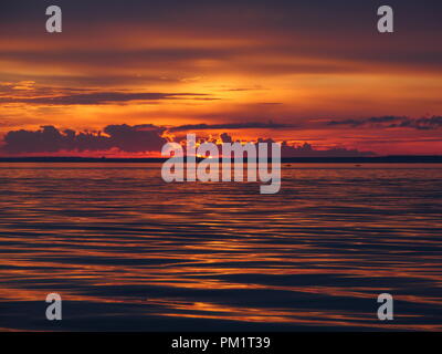 dramatic red sunset on the sea Stock Photo
