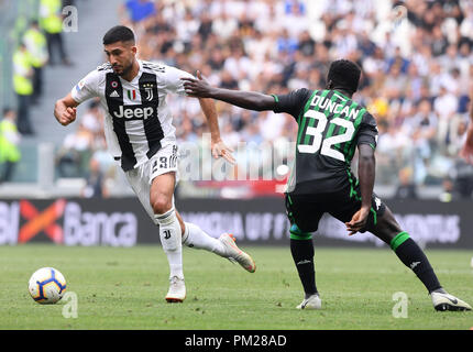 Turin, Italy. 16th Sep, 2018. FC Juventus' Emre Can (L) vies with Sassuolo's Alfred Duncan during the Serie A soccer match between FC Juventus and Sassuolo in Turin, Italy, Sept. 16, 2018. FC Juventus won 2-1. Credit: Alberto Lingria/Xinhua/Alamy Live News Stock Photo