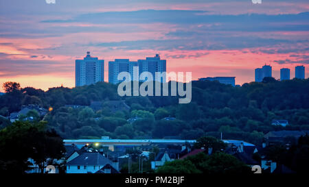 Glasgow, Scotland, UK, 17th September, 2018. UK Weather: Stormy weather ahead as a red dawn sky in the morning fire before storm Helene hits the city over Dawsholm park m the towers of Maryhill and the east of the city as morning sun warms up the morning sky. Gerard Ferry/Alamy news Stock Photo