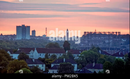 Glasgow, Scotland, UK, 17th September, 2018. UK Weather: Stormy weather ahead as a red dawn sky in the morning fire before storm Helene hits the city over kelvindale temple gasometer  m the towers of Maryhill and the east of the city as morning sun warms up the morning sky. Gerard Ferry/Alamy news Credit: gerard ferry/Alamy Live News Stock Photo