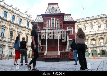 Royal Academy of Arts. London. UK 17 Sept 2018 - Transitional Object (Psychobarn) a 30 feet (10m), made from the components of a dismantled traditional American red barn and based on the house seen in Alfred Hitchcock’s film Psycho (1960) on display at the Royal Academy of Arts’ courtyard from 18 September 2018 – March 2019.  Credit: Dinendra Haria/Alamy Live News Stock Photo