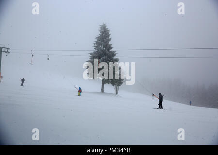 German people do skiing at Ruhestein Skilift, an ideal place for winter sport in Black Forest. Ruhestein Schänke, L401, Baiersbronn, Germany Stock Photo