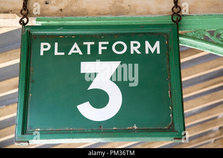 Hanging Green Platform Three Sign Stock Photo