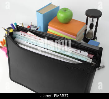close up. briefcase, hourglass and school supplies on white background Stock Photo