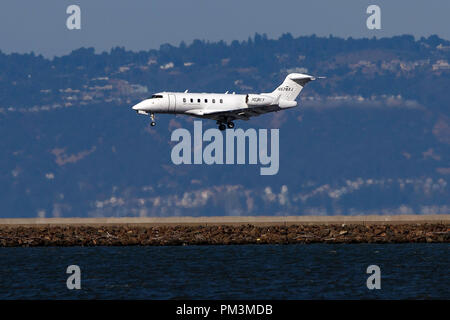 Bombardier Challenger 300 (N578XJ) operated by Xojet landing at San Francisco International Airport (KSFO), San Francisco, California, United States of America Stock Photo