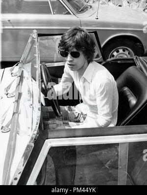 Mick Jagger of The Rolling Stones about to get into his car after Stock ...