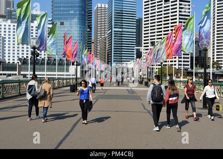 People Walking On Pyrmont Bridge In Darling Harbour Sydney Australia. Stock Photo