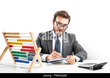 Nerd accountant does calculation of company revenue Stock Photo