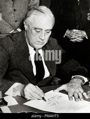 President Franklin Delano Roosevelt signing declaration of war against Japan December 8, 1941  File Reference # 1003 405THA Stock Photo