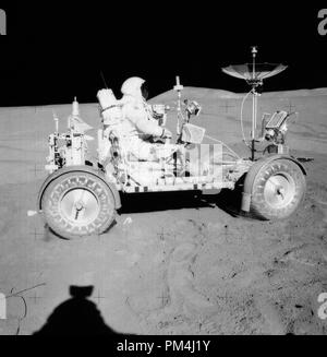 David R. Scott, Apollo 15 Commander, is seated in the Rover, Lunar Roving Vehicle (LRV) during the first lunar surface extravehicular activity (EVA-1) at the Hadley-Apennine landing site, August 1, 1971.  File Reference # 1003 478THA Stock Photo