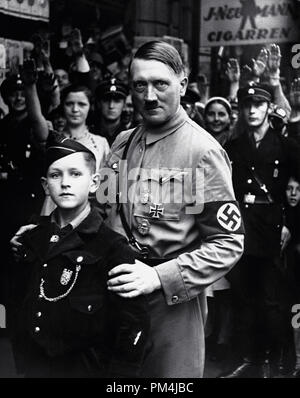 Nazi dictator Adolf Hitler poses with a young member of the Nazi Youth, circa 1934   File Reference # 1003 651THA Stock Photo
