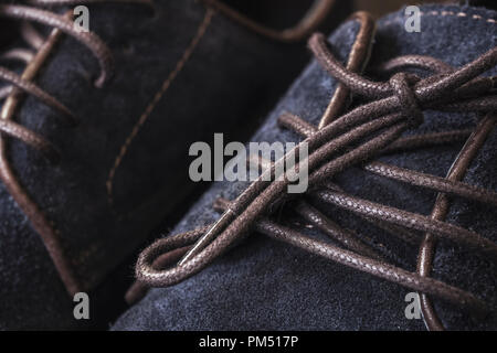 Close up of men's brogues made from blue oiled suede Stock Photo