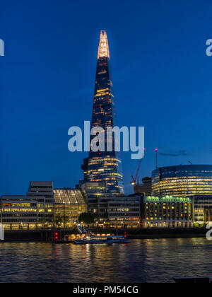 LONDON, UK - AUGUST 25, 2018:  View of the Shard building  Lit-Up at night seen across the River Thames Stock Photo