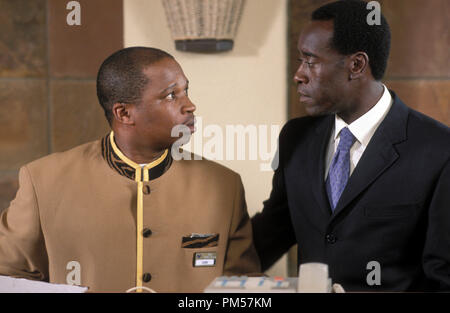 Film Still from 'Hotel Rwanda' Desmond Dube, Don Cheadle © 2004 United Artists Photo Credit: Frank Connor  File Reference # 30735270THA  For Editorial Use Only -  All Rights Reserved Stock Photo