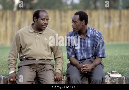 Film Still from 'Hotel Rwanda' Paul Rusesabagina, Don Cheadle © 2004 United Artists Photo Credit: Frank Connor  File Reference # 30735272THA  For Editorial Use Only -  All Rights Reserved Stock Photo