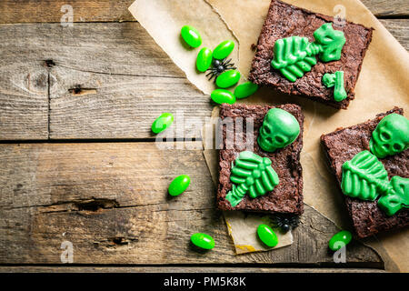 Halloween style party sweet - brownie with green skeleton and bones Stock Photo