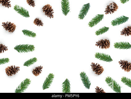 Natural Christmas layout composition, top view with fir tree branches and pine cones in a circle shape. Stock Photo