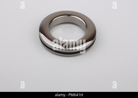 Plastic rings for fastening the fabric to the cornice for curtains. Multicolored plastic eyelets. Square, rectangular, triangular, eyelets for curtain Stock Photo