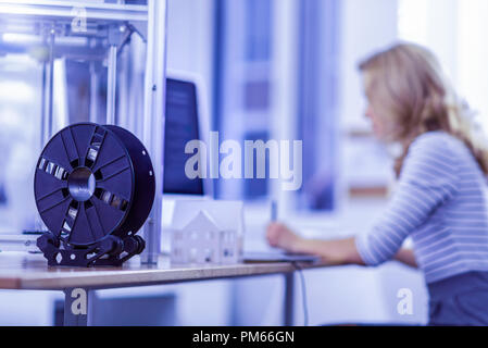 Silhouette of serious worker sitting in semi position Stock Photo