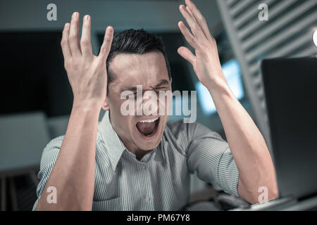 Young business man stressed out at work Stock Photo