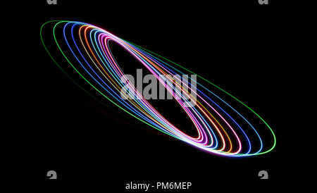 Colourful abstract with swooshes, swirls, spirals and elipses on a black background. Stock Photo