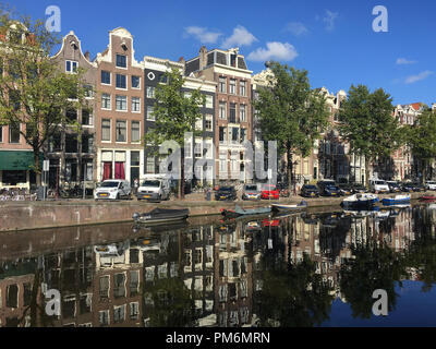 Canal and buildings in Amsterdam, Netherlands on a sunny summer afternoon