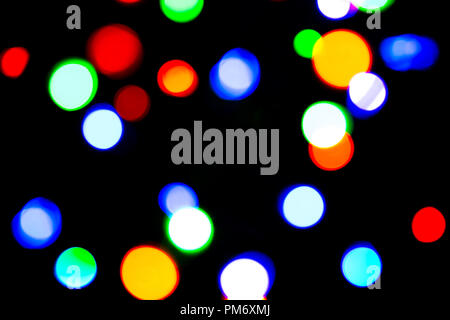 Blurred background with colorful bokeh lights on dark purple and blue background/blurred Christmas lights Stock Photo
