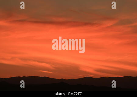 Evening sky with stunning sunset afterglow over the mountain range of San Pedro de Atacama in northern Chile, South America Stock Photo