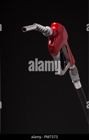 A gasoline pump nozzle with a red vinyl covered handle isolated on black Stock Photo