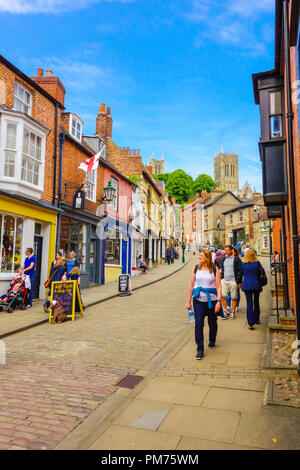 Tourists and locals mingle on Steep Hill, part of the historic city of Lincoln Lincolnshire UK. May 2018 Stock Photo