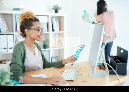 Creative African-American Designer at Desk Stock Photo
