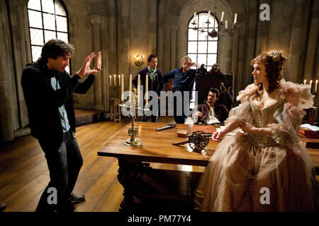 (L to R) Director PAUL W. S. ANDERSON with ORLANDO BLOOM (seated) and MILLA JOVOVICH on the set of THE THREE MUSKETEERS. Stock Photo