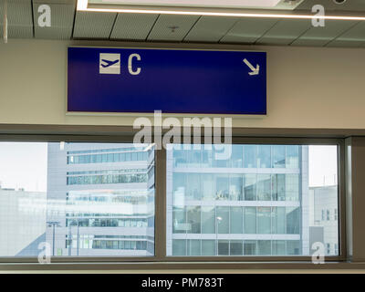 Frankfurt Airport showing C Gates sign and Terminal down below Stock Photo