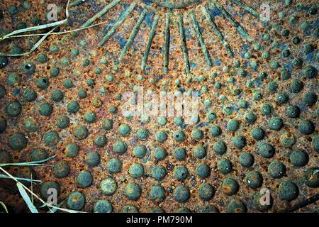 old rusty metal background with perforated circles Stock Photo